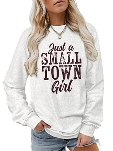 Detail of Just a Small Town Girl graphic on a grey crewneck long sleeve sweatshirt
