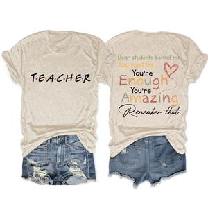 Detail of inspirational back print on beige cotton teacher t-shirt for women