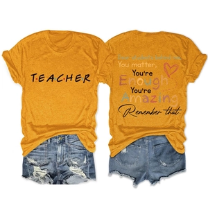 Detail of Teacher t-shirt back with inspirational quotes and heart graphic pattern
