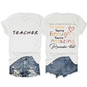 Detailed view of white cotton T-shirt front and back with teacher themed typography