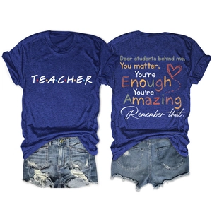 Front and back view of a navy blue teacher t-shirt featuring inspirational quotes on back