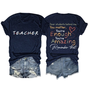 Close-up of Teacher t-shirt back print with inspirational quote and heart graphic