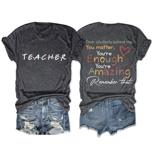 Charcoal grey teacher t-shirt featuring motivational quote print and crew neck design