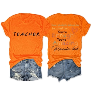Front and back view of an orange Teacher t-shirt with inspirational quote print