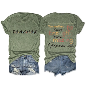 Green t-shirt showing front and back teacher print with denim shorts set on white background
