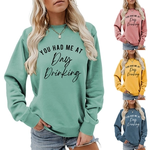 Detail of long sleeve sweatshirts featuring 'YOU HAD ME AT' print in four colors