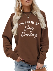 Detail of coffee brown sweatshirt with white You Had Me At Day Drinking slogan print
