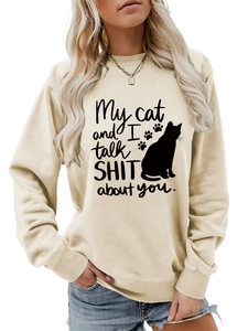 Detail of the ribbed neckline and cat print on this beige long sleeve sweatshirt