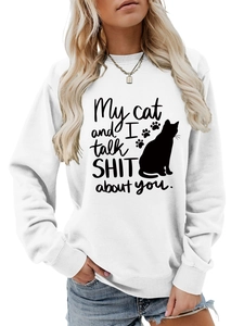 Detail of the white crewneck sweatshirt featuring a black cat graphic and funny text
