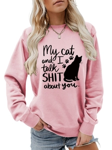 Detail of pink crewneck sweatshirt with 'My cat and I talk SHIT about you' slogan print