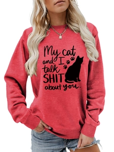 Close-up of red crewneck sweatshirt with 'My cat and I talk shit about you' print