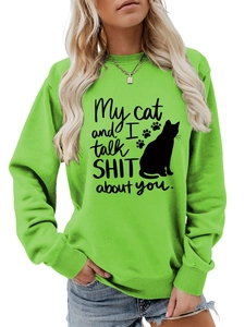 Detail of neon green crewneck sweatshirt with My cat and I talk SHIT about you print