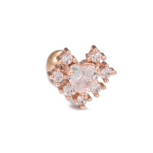 Macro view of rose gold heart stud earring with zircon stones and screw ball back