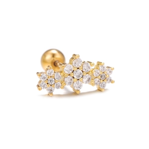 Detailed view of golden flower cartilage stud with micro-set zircons and screw ball back