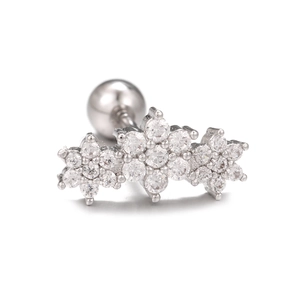Detail of silver heart ear bone stud with three zircon flowers and screw back ball
