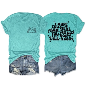 T-shirt bleu sarcelle avec motif de cœur et texte inspirant au dos en détail