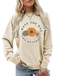 Detail of ribbed cuffs and high-quality floral print on a beige crewneck sweatshirt