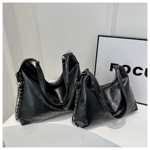 Detailed comparison of two black glossy PU hobo bags with embossed logo and metal chains