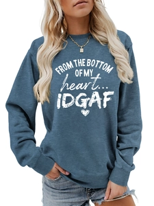 Detail of blue crewneck sweatshirt featuring From The Bottom Of My Heart white print