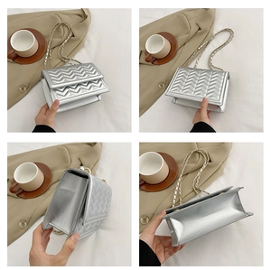 Detail views of a silver chevron quilted chain bag with gold hardware and strap details
