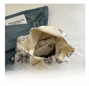Detailed top view showing the spacious interior of the white butterfly print tote bag