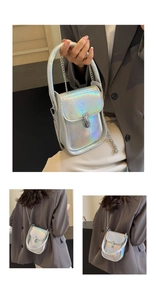Detail of laser silver holographic PU leather bag with metal chain and hard handle