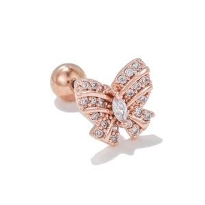 Macro detail of rose gold butterfly ear stud with micro-paved sparkling zircon stones