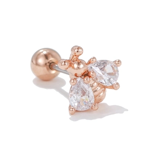 Macro shot of rose gold bee piercing stud with cubic zirconia wings and ball back