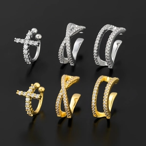Set of 6 gold and silver C-shaped ear cuffs with sparkling zircons on black background