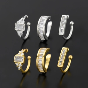 Lot de six bagues d'oreille plaquées or et argent serties de zircons cubiques