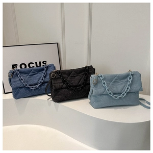 Quilted denim crossbody bags in navy, black and light blue with chunky chain strap