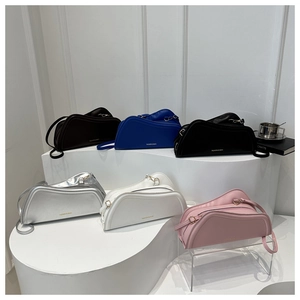 Unique asymmetric half-moon crossbody bags in six colors with minimalist design