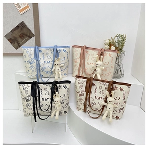 Women's Graffiti Letter Print PU Leather Tote Bag Large Capacity Urban Casual Shoulder Bag With Cute Bunny Charm Daily Bag