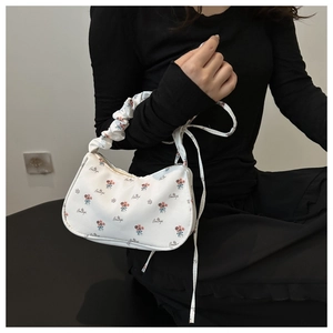 Floral print bag with ruched handle and 'Beautiful' text design for casual summer style