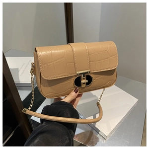 Beige crocodile-textured crossbody bag with golden clasp and chain strap for women