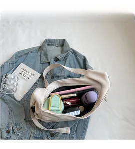 Interior view of large capacity cream tote bag showing spacious storage for daily items