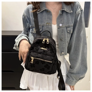 Mini black floral jacquard backpack for women with gold zippers and stylish metal trim