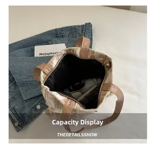 Interior view showing the large capacity of the beige velvet tote bag with brown straps