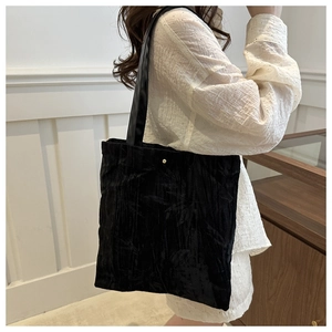 Retro black velvet tote bag with bamboo leaf embroidery and gold snap closure