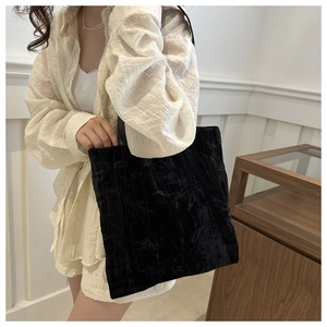 Detailed close-up of vintage black velvet tote bag featuring bamboo leaf embroidery