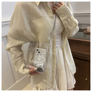 Detailed view of clear PVC bag with 'SUMMER' print showing storage capacity for essentials