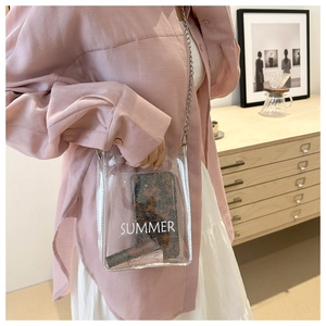 Clear PVC crossbody bag with silver chain and Summer print for beach travel