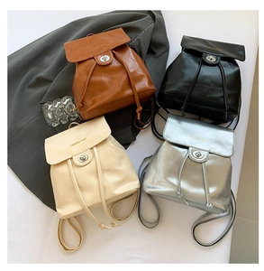 Mini oil wax leather backpacks in brown, black, cream, and silver with twist lock