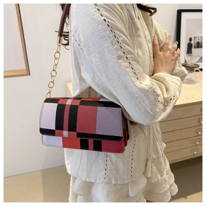 Minimalist geometric checkered shoulder bag with gold chain strap in modern plaid design