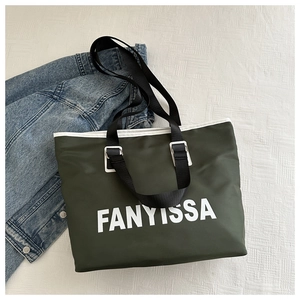 Detailed view of large olive green tote bag with FANYISSA logo on white background