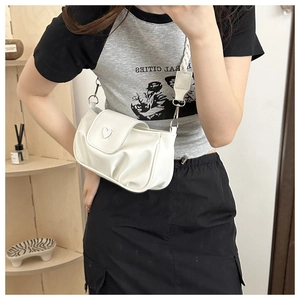 White heart-shaped pleated shoulder bag with silver buckle and braided strap detail