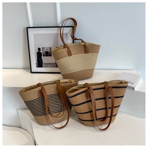 Three woven straw tote bags with contrast stripes and brown leather shoulder straps
