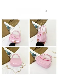 Four-angle view of a mini pink jelly bag with pearl button and gold chain strap