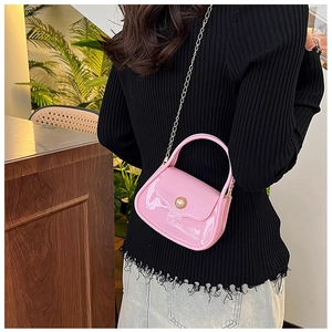 Pink jelly handbag featuring a pearl metallic buckle and elegant gold chain strap detail