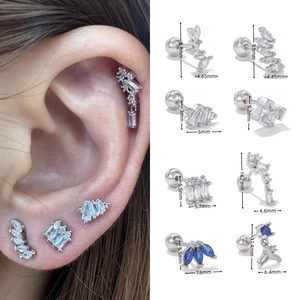 Detailed size chart for geometric blue zircon stud earrings with human model wearing display
